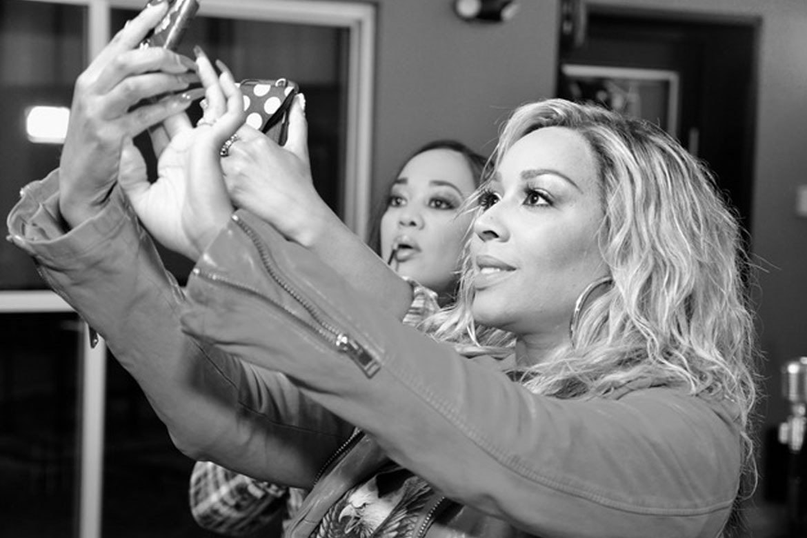 Kim and Kandy taking selfies.